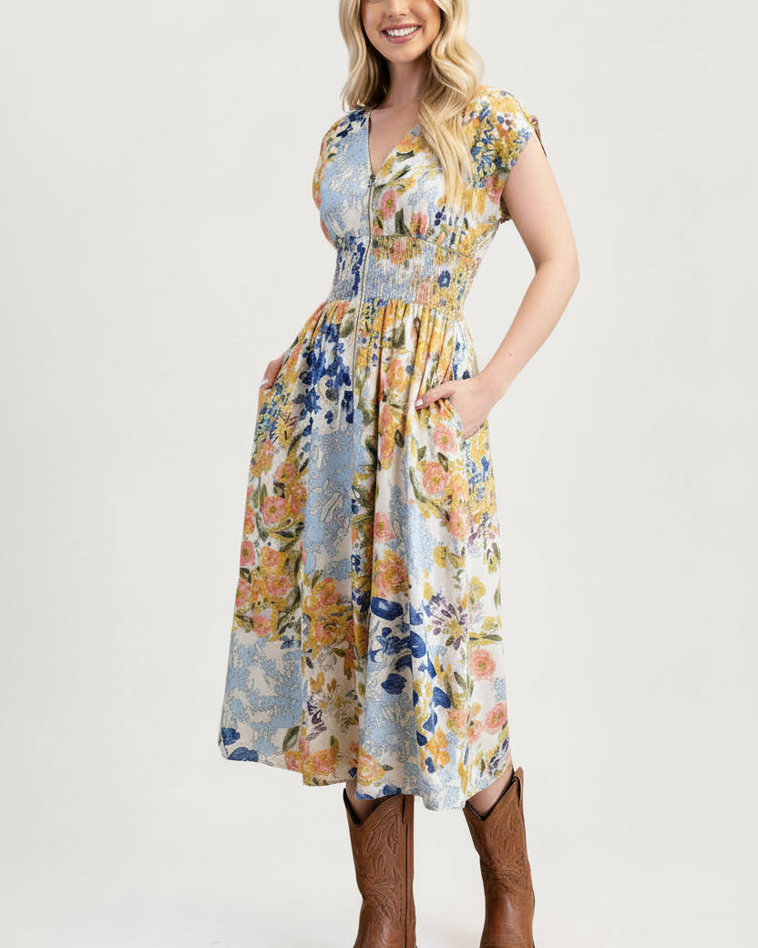 Woman wearing a floral dress with brown boots on a white background